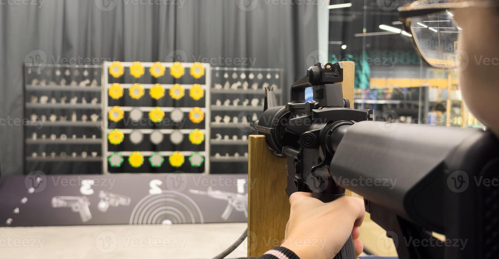 Shooters practicing tactical shooting in a modern indoor gun range. photo