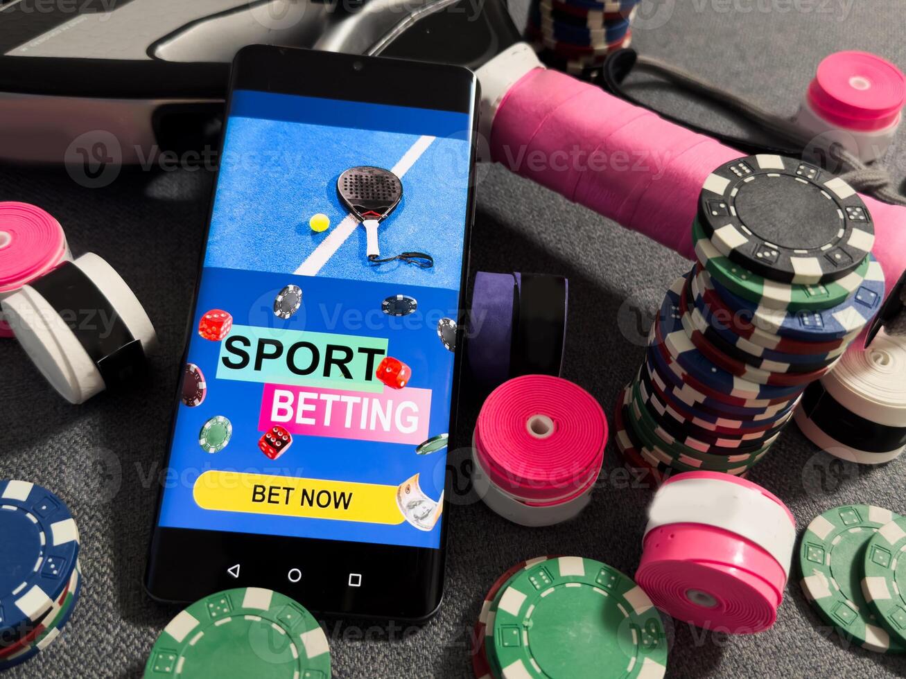 padel tennis and sports betting on a smartphone. Concept of sports bet photo