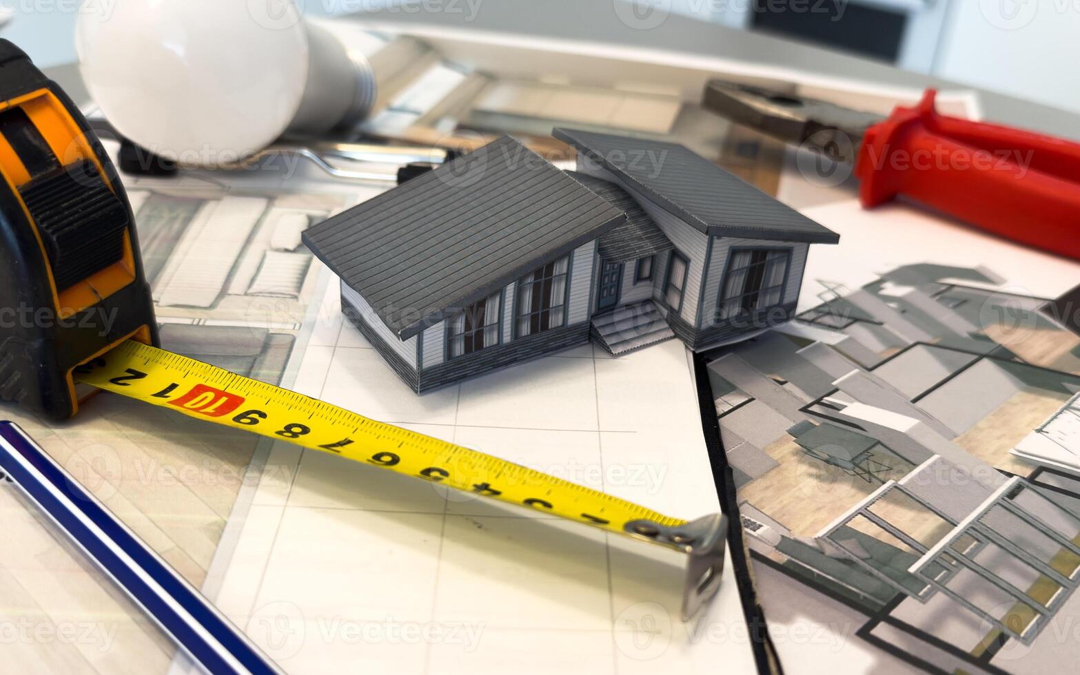 Architectural engineering design plan drawing on the table. Architect's work on table in studio. Construction design and plan photo