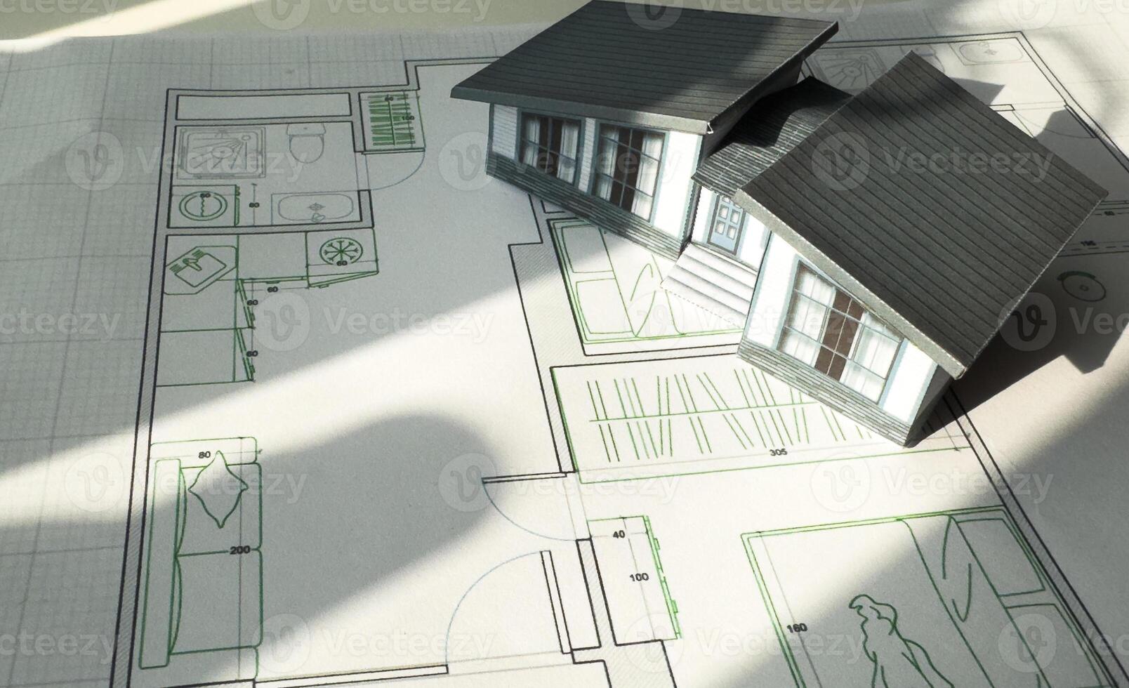 building house on blueprints with worker construction project photo
