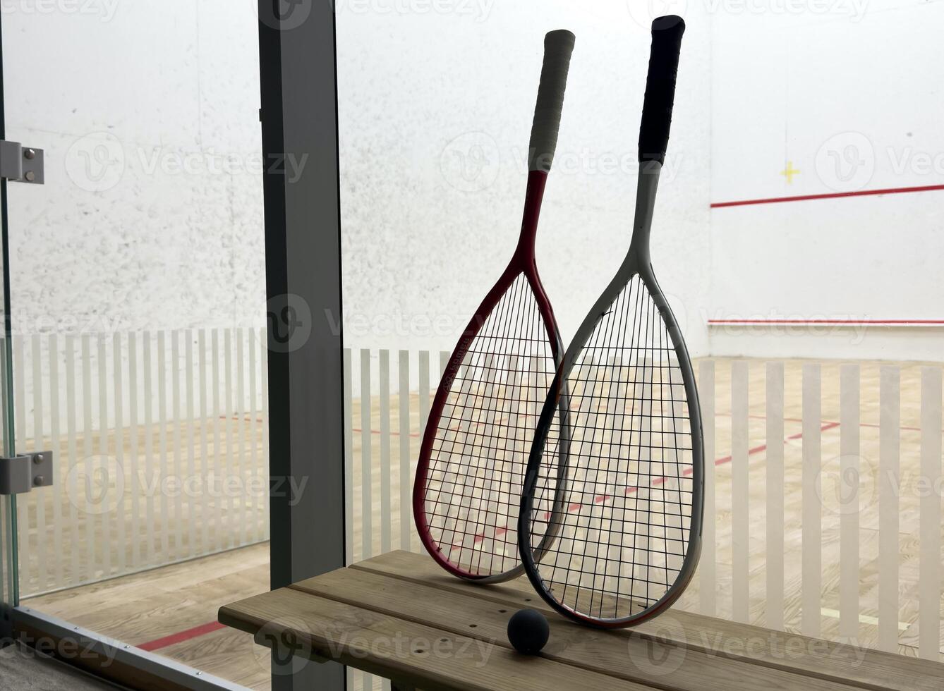 Sports, above and racket on squash court for competition, challenge and training center. Exercise, interior and empty room with top view of wooden floor of gymnasium for games, fitness club and gear photo