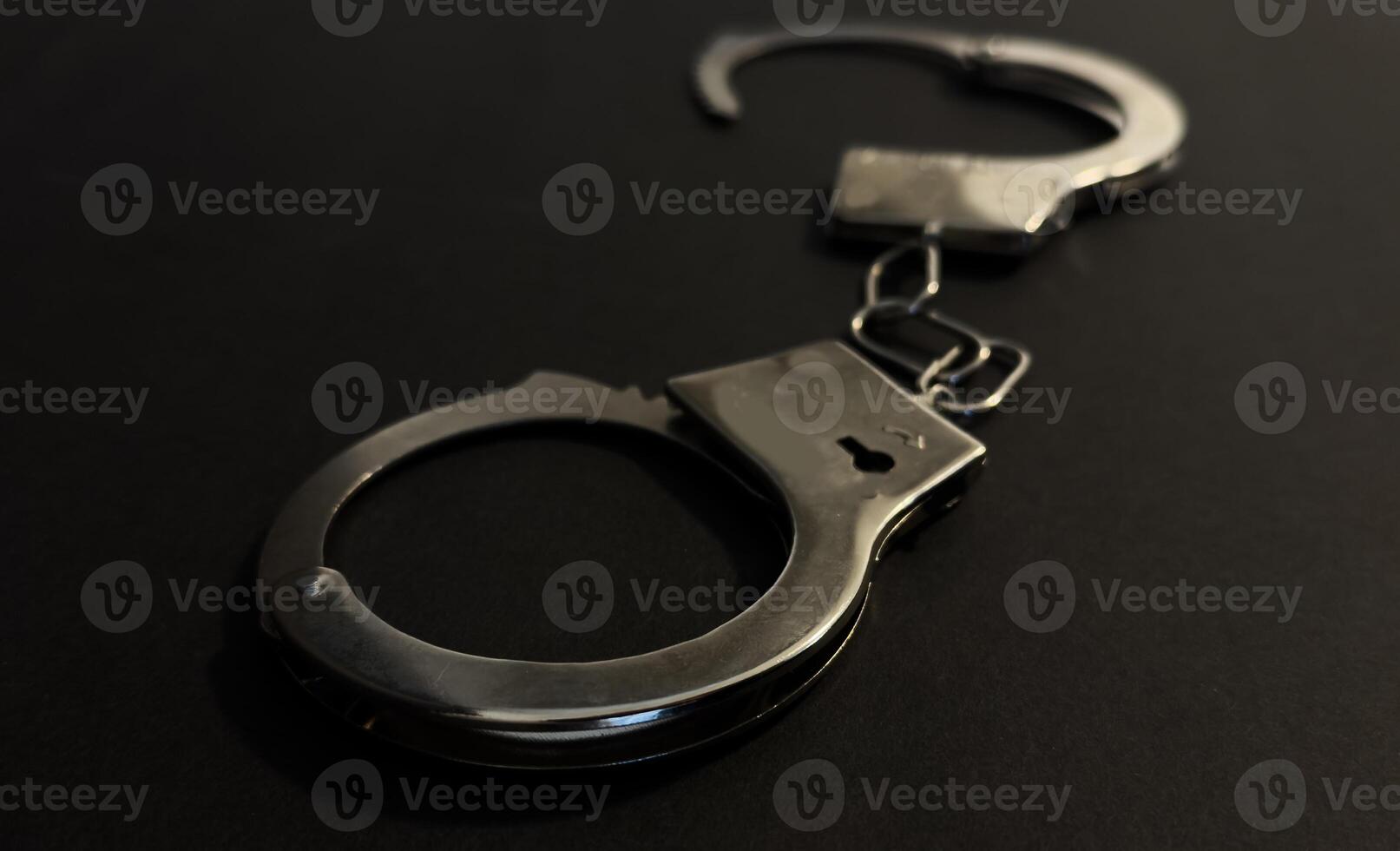 Handcuffs on a black background photo
