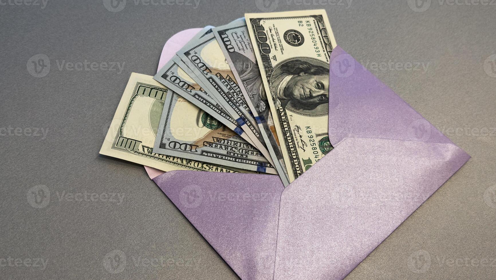 100 dollar bills in a envelope photo