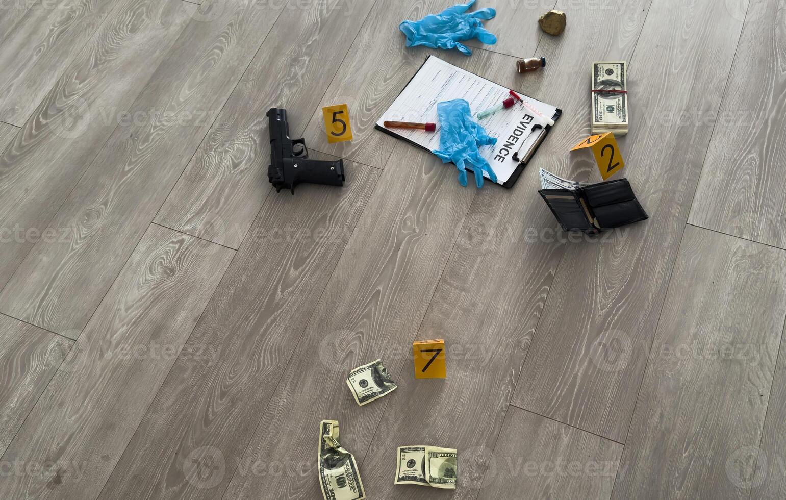 Crime scene, physical evidence. Gun handcuffs, money, dollar on a dark background. photo