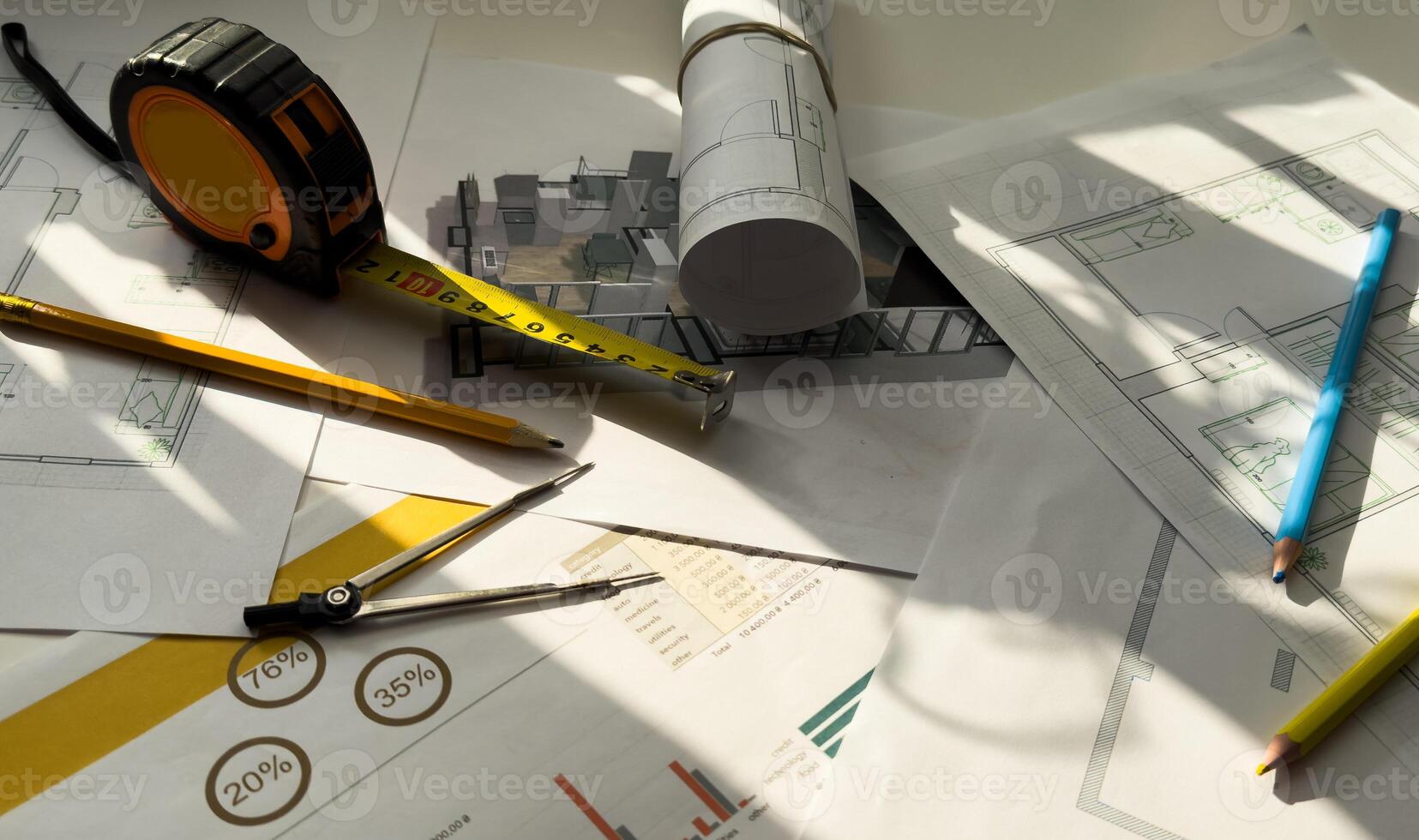 building house on blueprints with worker construction project photo