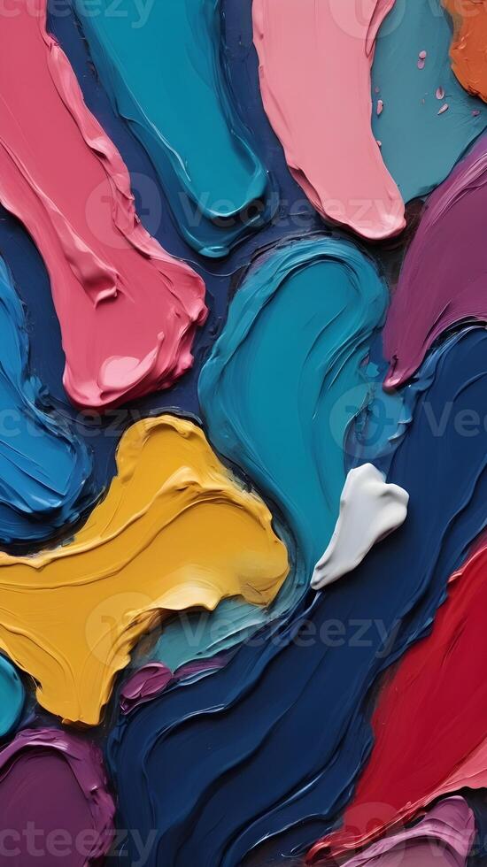 A close view of layered, vibrant oil paint strokes with raised surfaces. photo