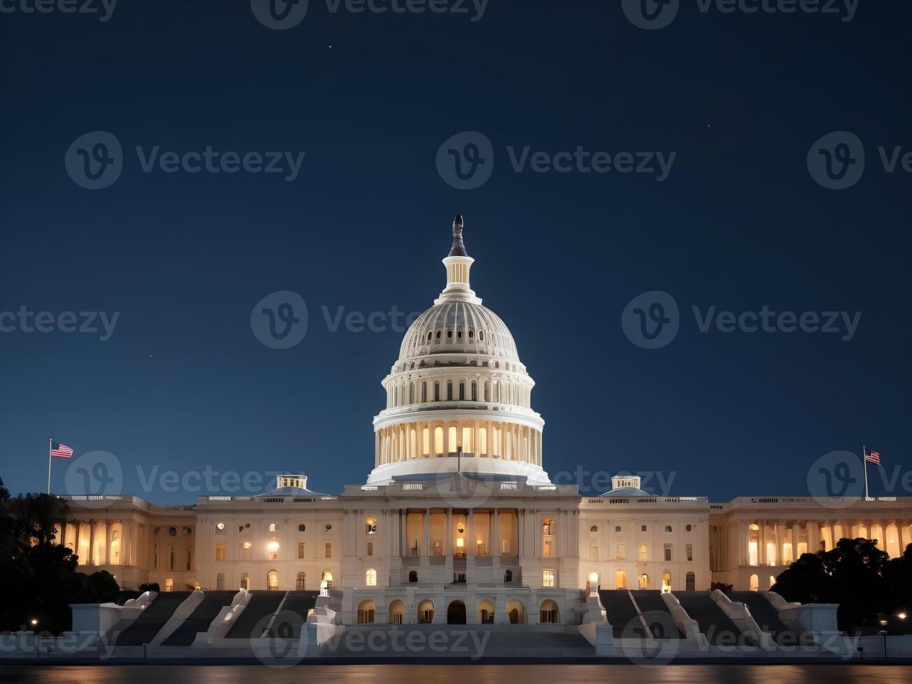 A dramatic night scene of the U.S. Capitol, softly lit with a blurred foreground perfect for Presidents Day copy. photo