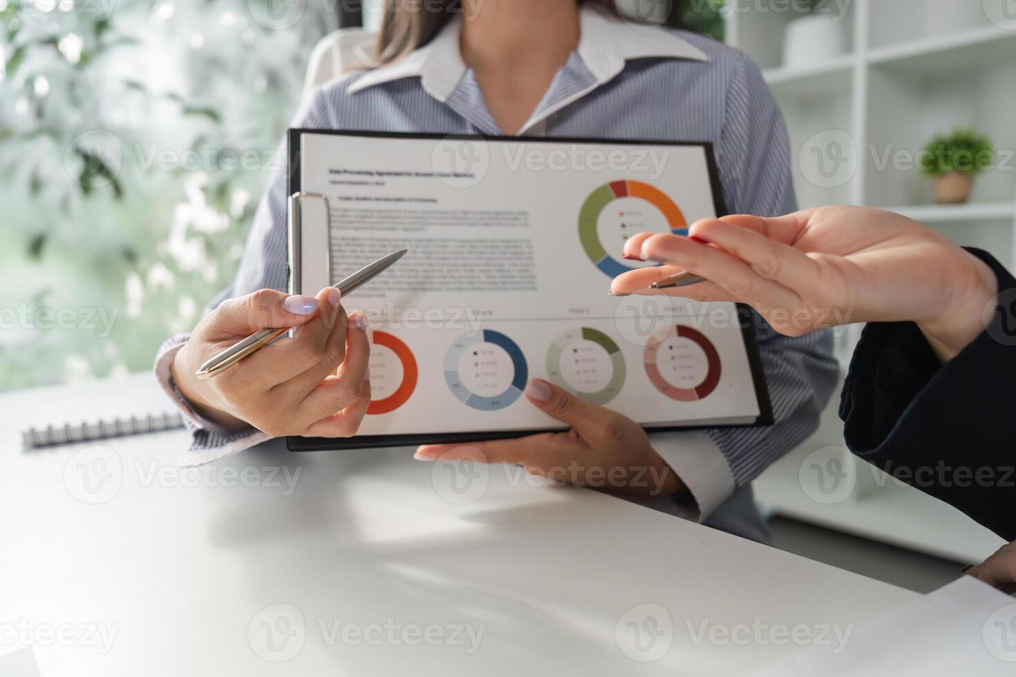 Financial professionals analyzing data and discussing strategies in a collaborative setting. photo