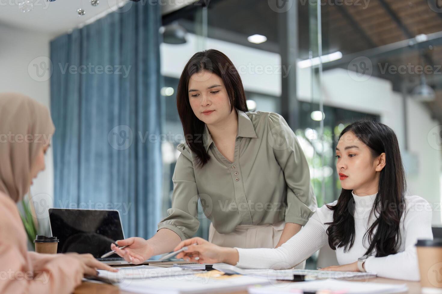 Office team discussing financial strategies in a collaborative meeting. photo