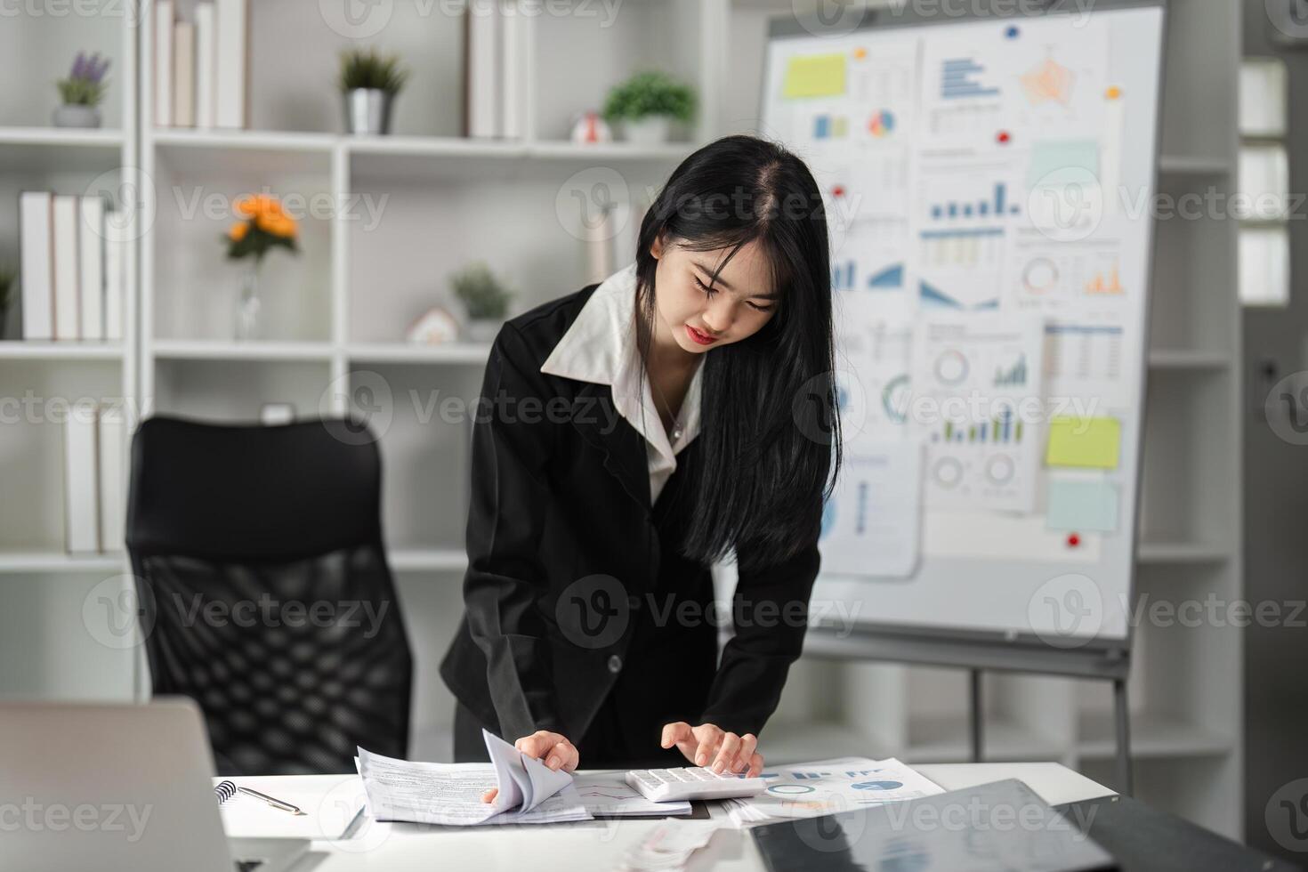 Accountant engaged in financial analysis and document review. photo