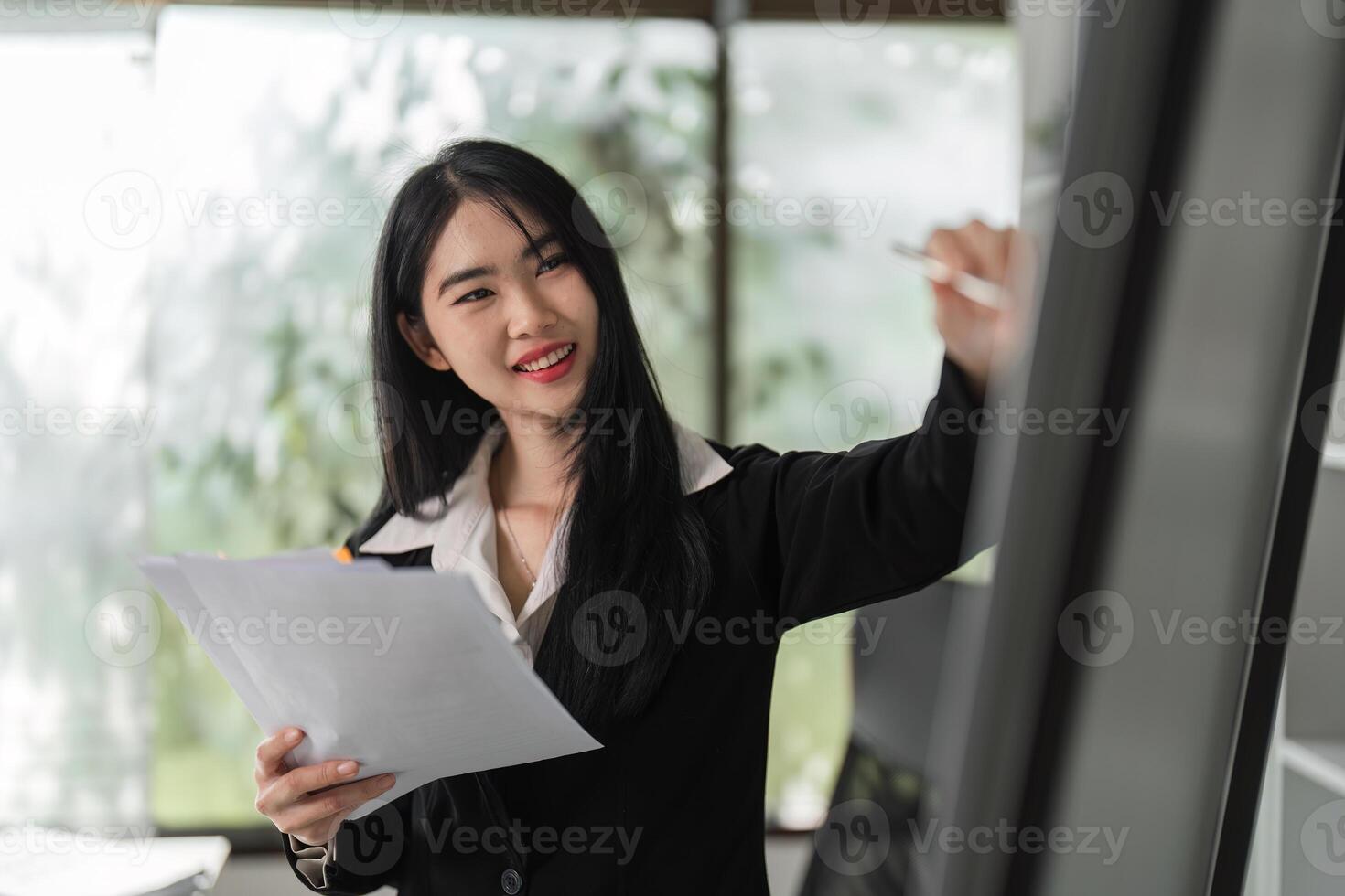 Smiling accountant presenting financial insights and tax strategies in a modern workspace. photo