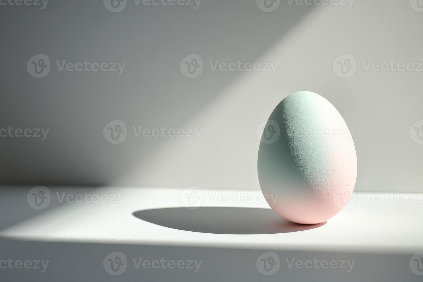 Pastel-colored egg in soft lighting creating a minimalist composition photo