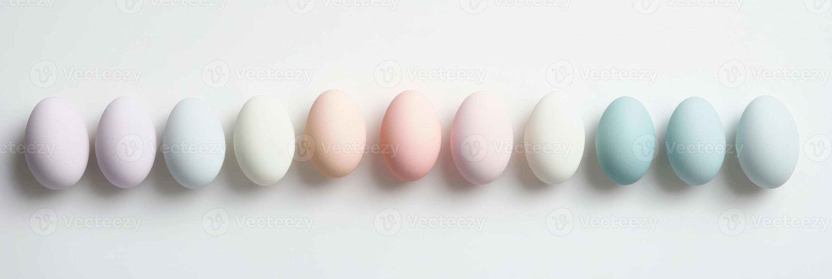 Elegant row of pastel colored eggs displaying subtle color variations and symmetry photo