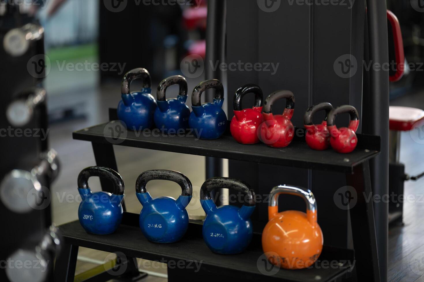 A pair of dumbbells neatly arranged in the gym, ready for a powerful workout session to build strength and endurance photo