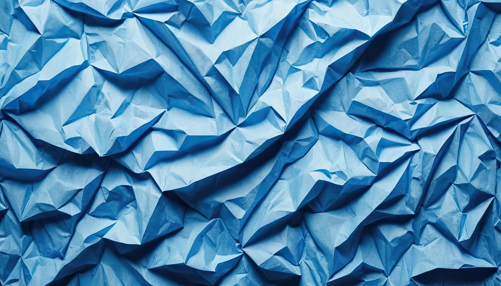 Abstract Crumpled Blue Paper Texture Background with Intricate Wrinkles and Geometric Patterns photo