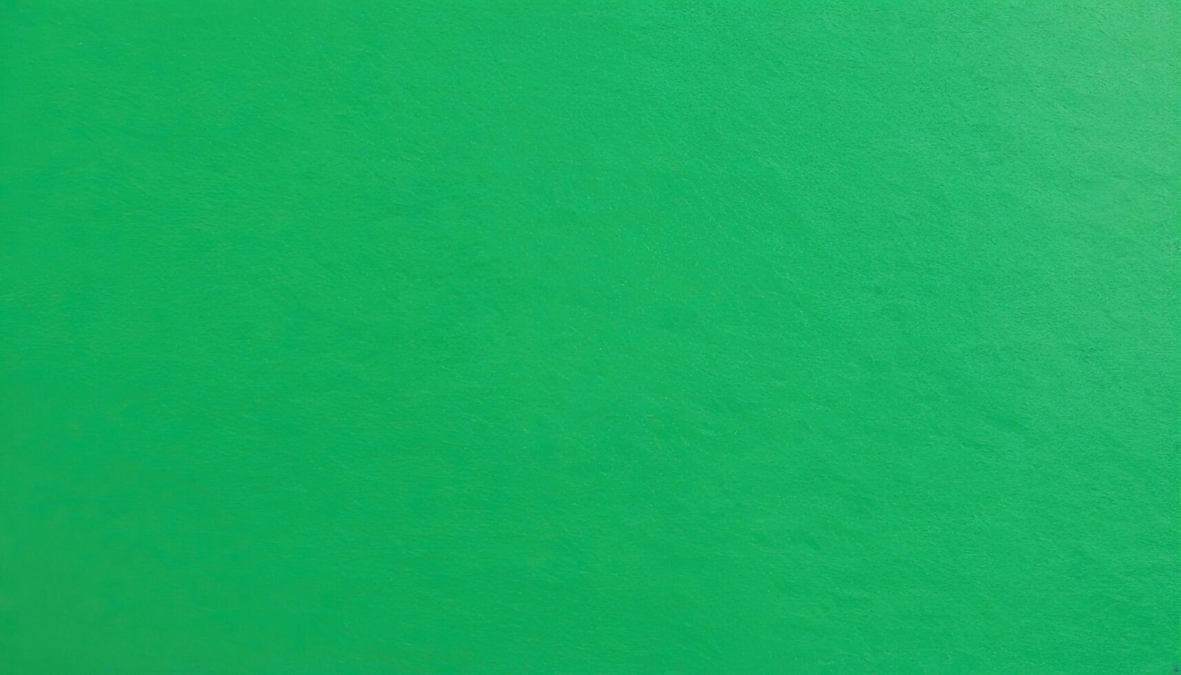 Vibrant Green Solid Color Background with a Smooth Texture and Even Lighting photo