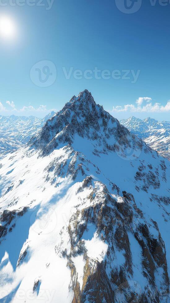 Majestic snow-capped mountain peaks under clear blue sky photo