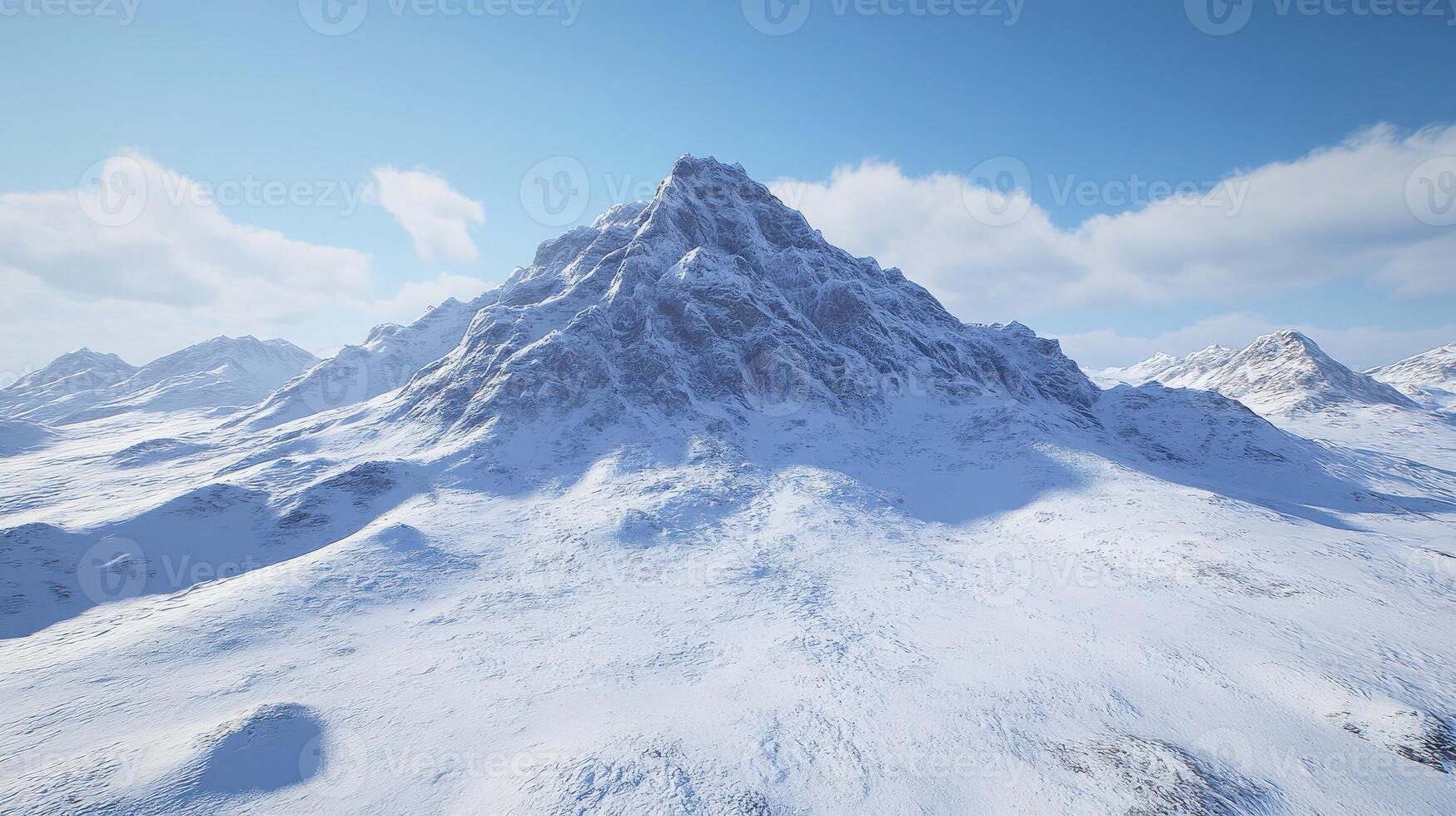 Snow-covered mountain landscape in bright daylight photo