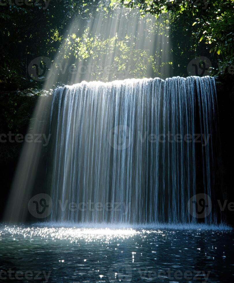Serene waterfall glistening in sunlight surrounded by greenery photo