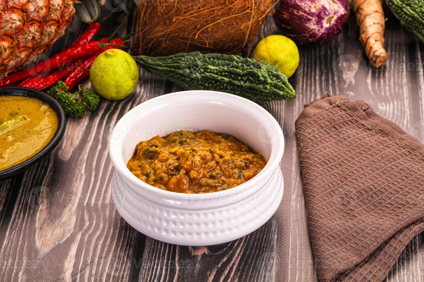 A bowl of food with vegetables and other ingredients photo