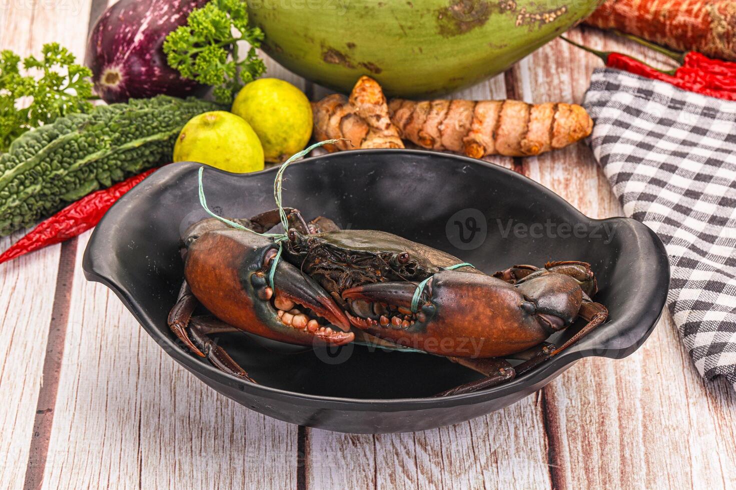 A bowl of food with a lobster in it photo