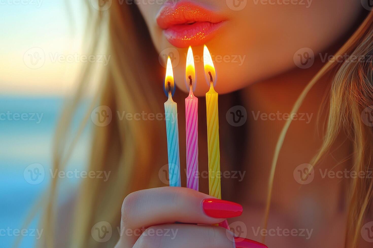 Celebrating a special moment with birthday candles at sunset photo