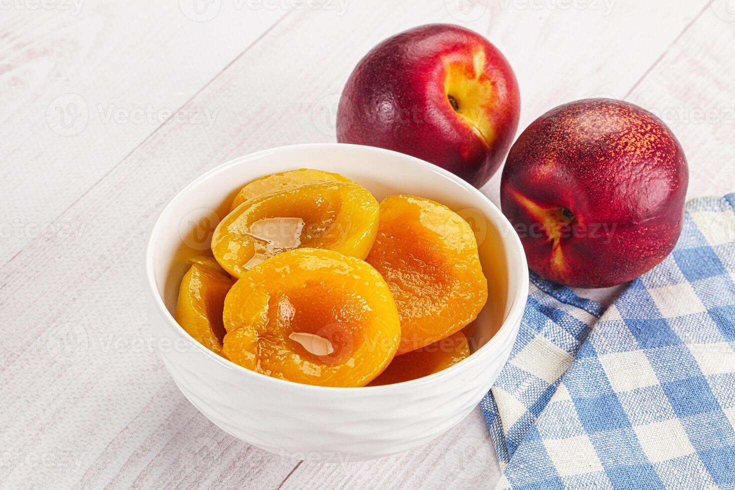 A bowl of fruit on a table photo