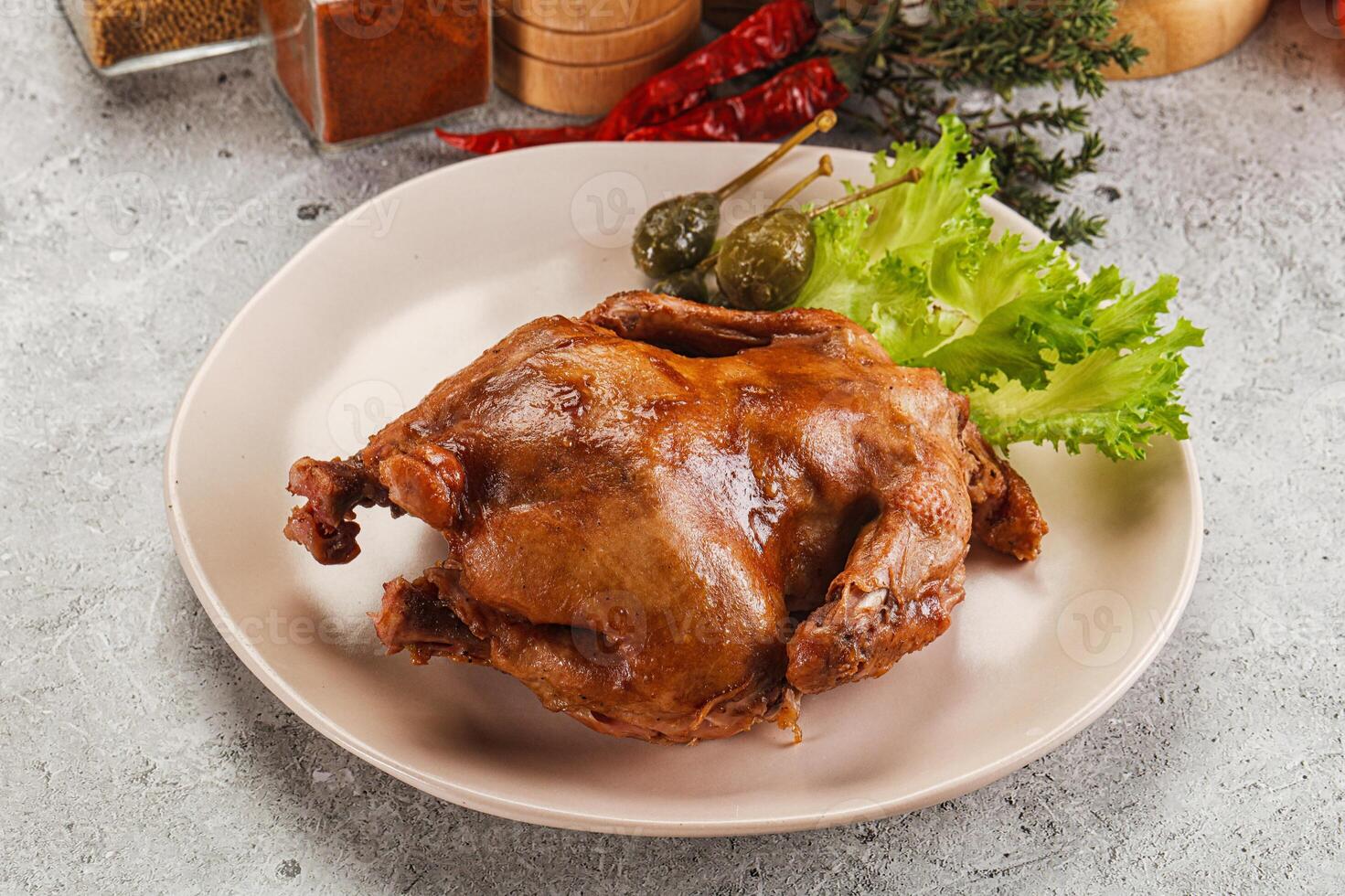 A plate of food with a chicken on it photo