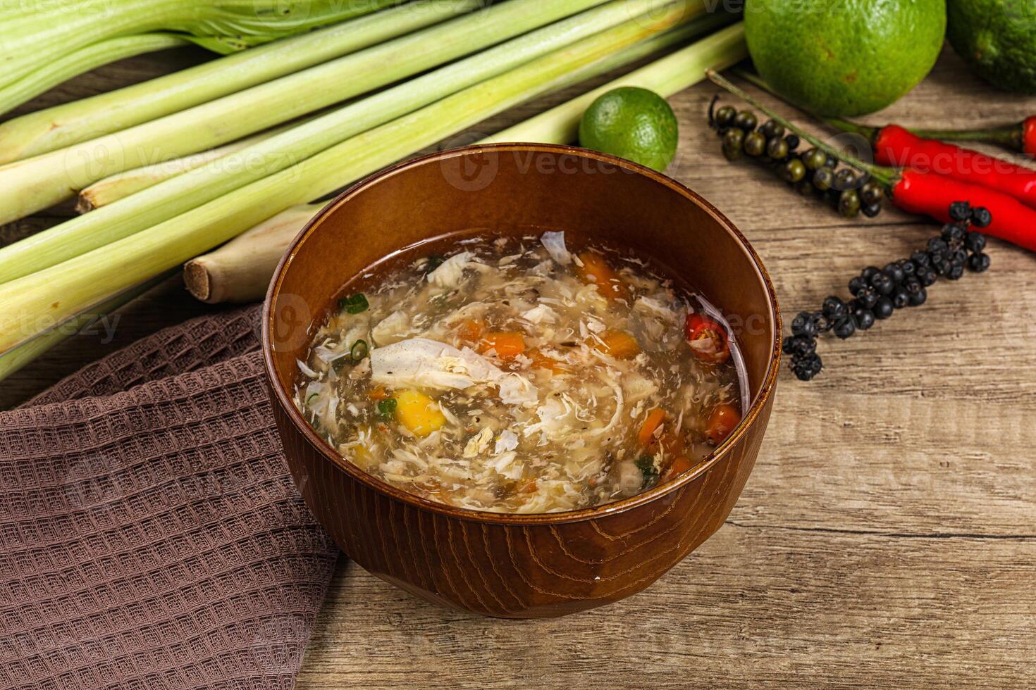 A bowl of soup with vegetables and other ingredients photo