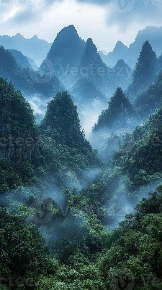 A misty mountain range with green trees and mountains photo