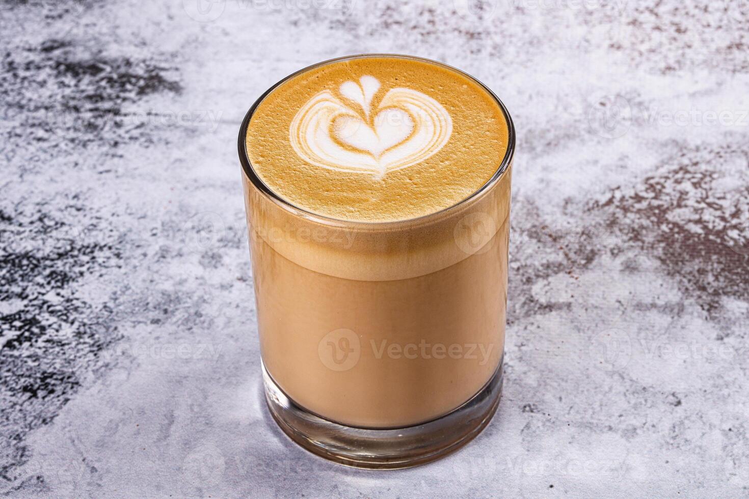 A latte with a heart design in the middle photo