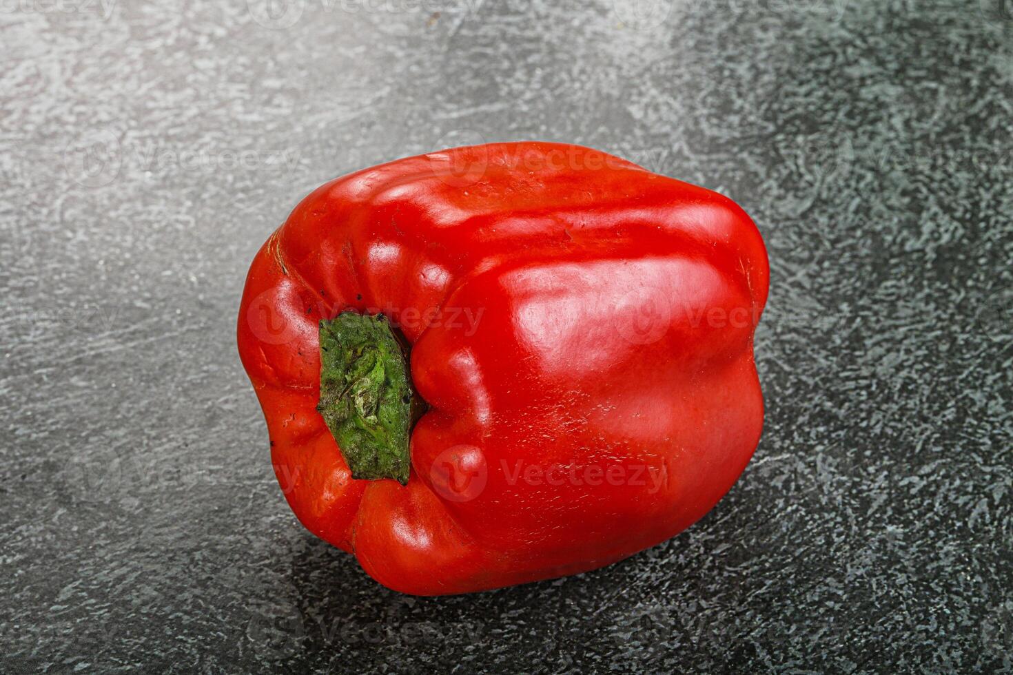 A red pepper on a table photo