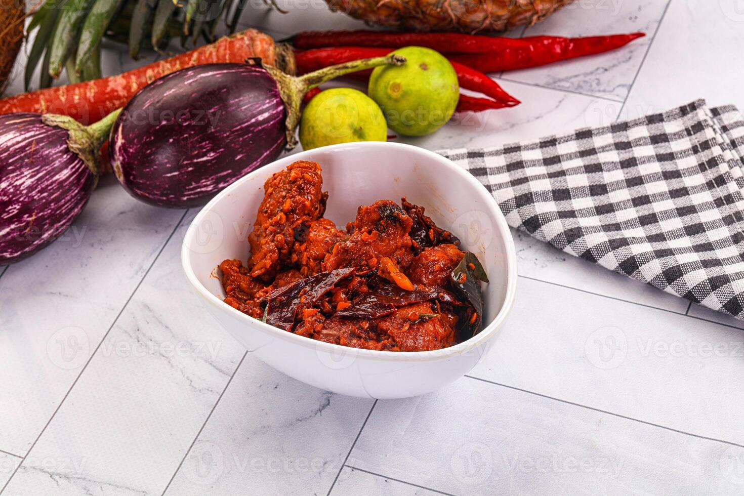 A bowl of food with a knife and a knife photo