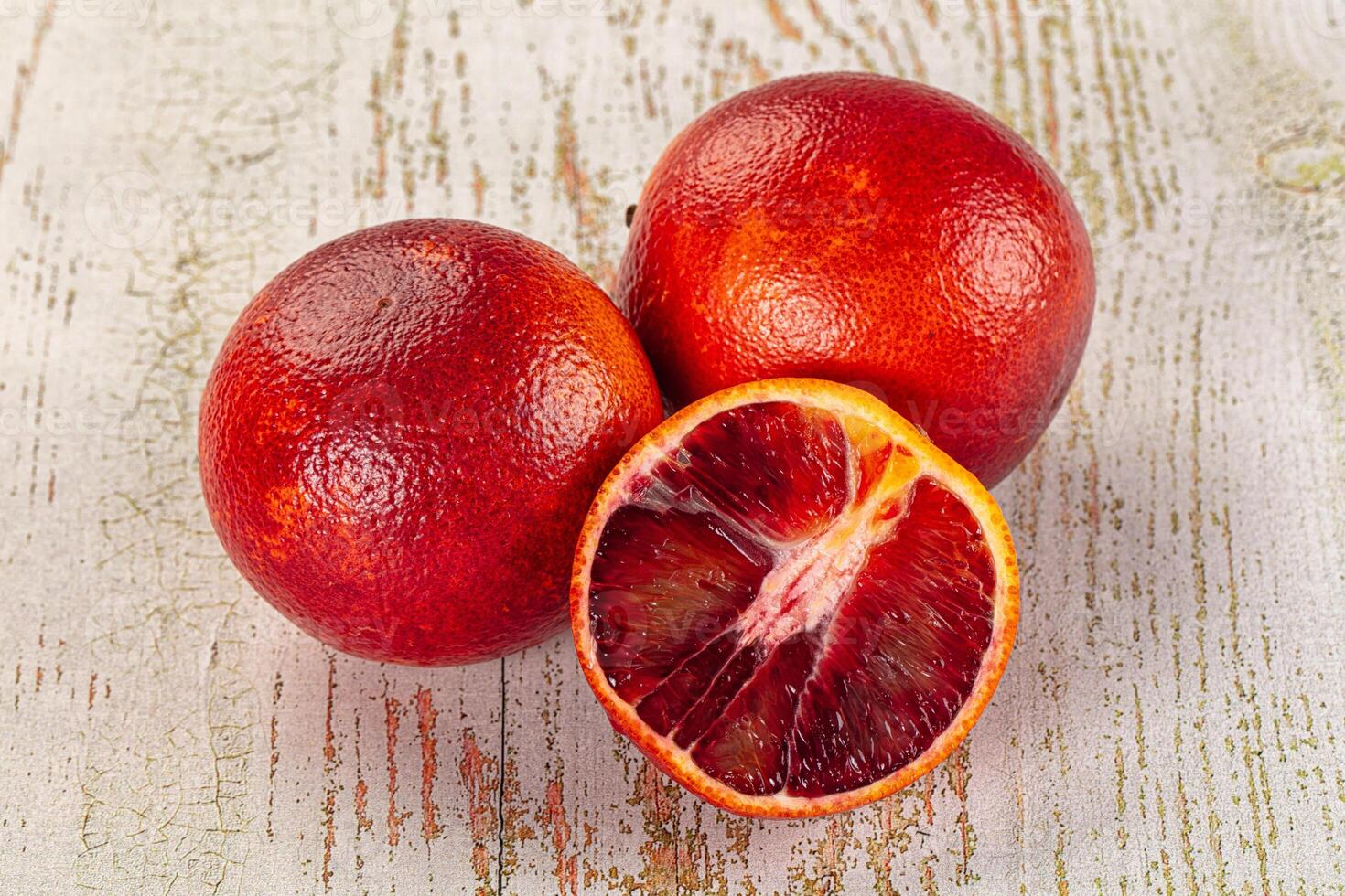 A table with three red fruits photo