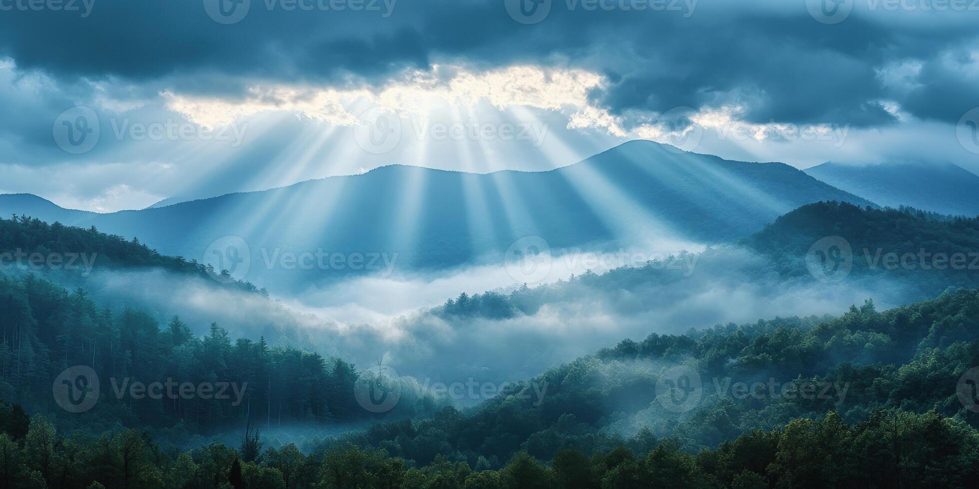 Nature's beauty in misty mountains with rays of sunlight photo