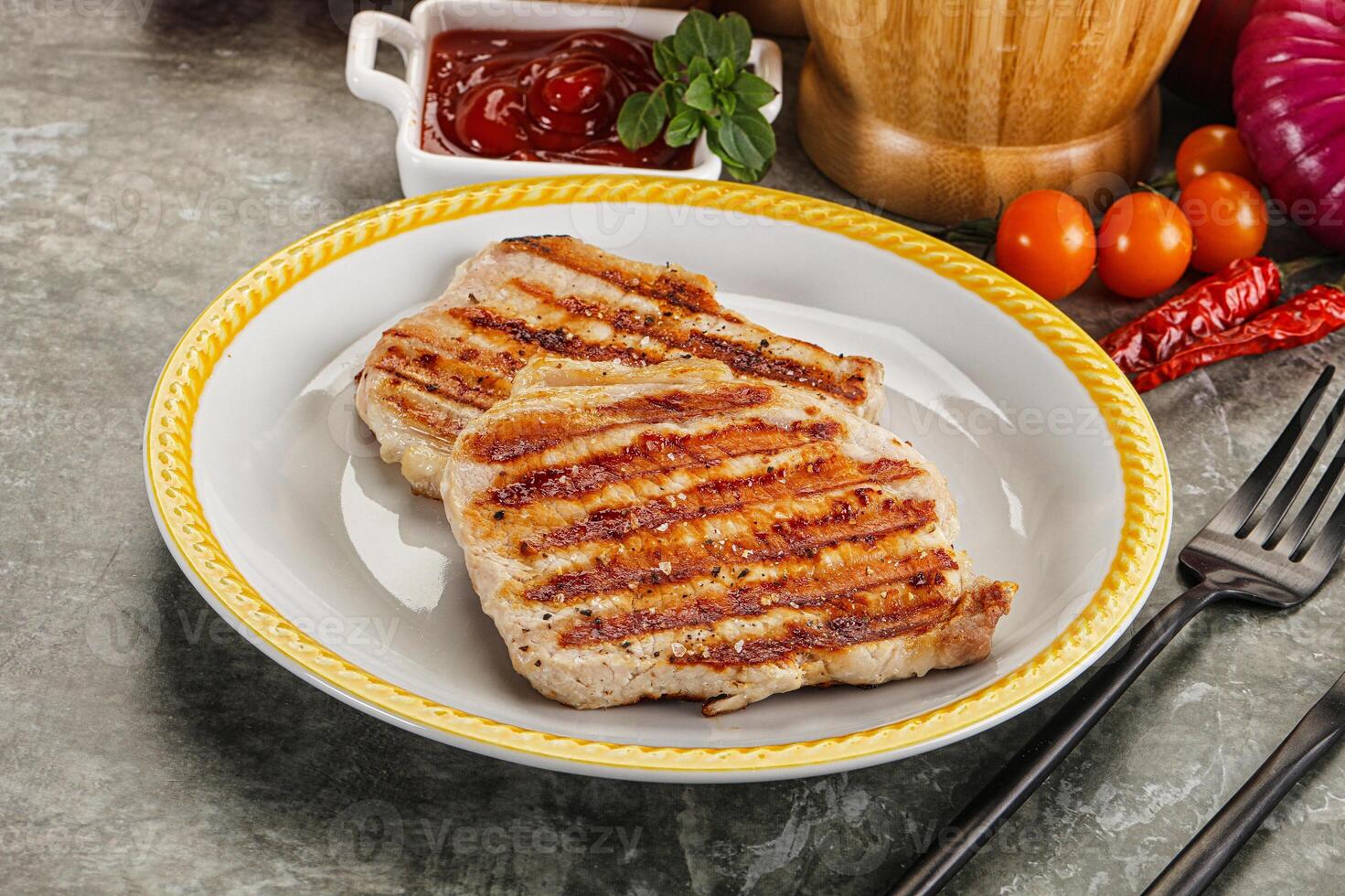 A plate of food with a knife and fork photo