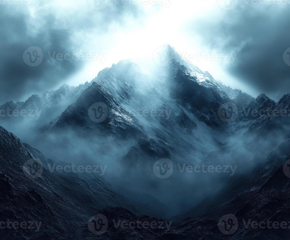 Misty mountain peak shrouded in fog and clouds photo
