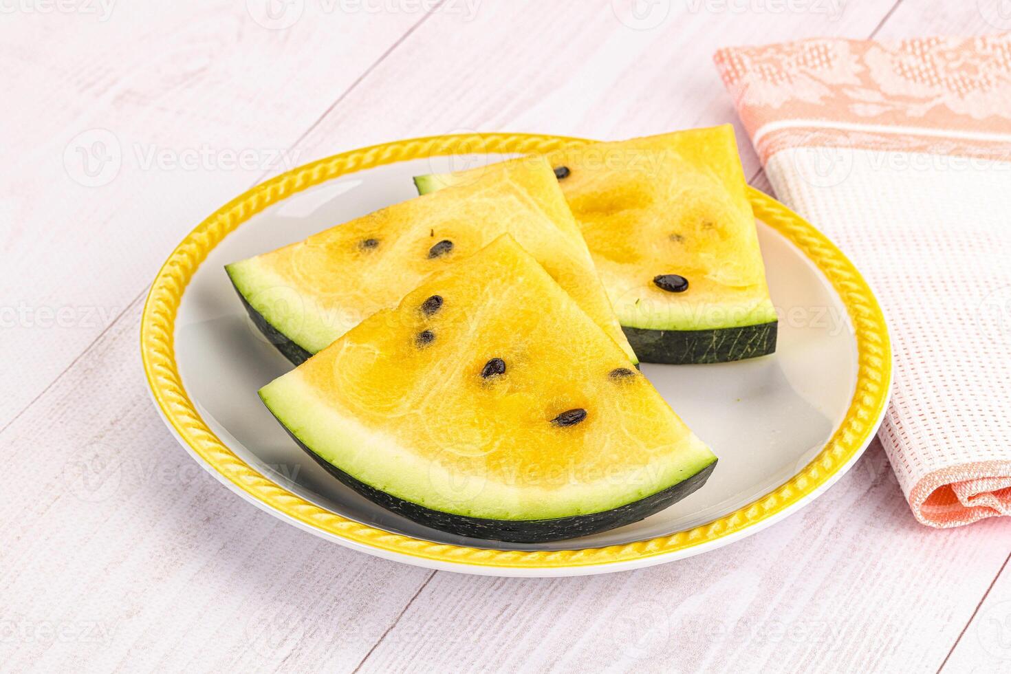 A plate with slices of watermelon on it photo