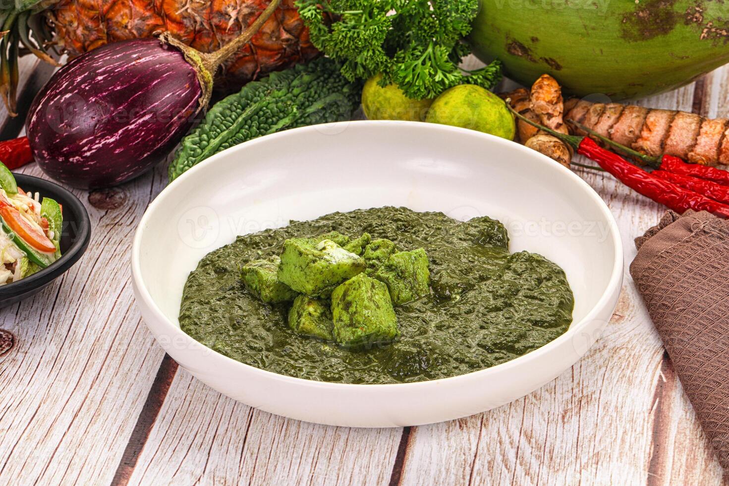 A bowl of green food on a table photo