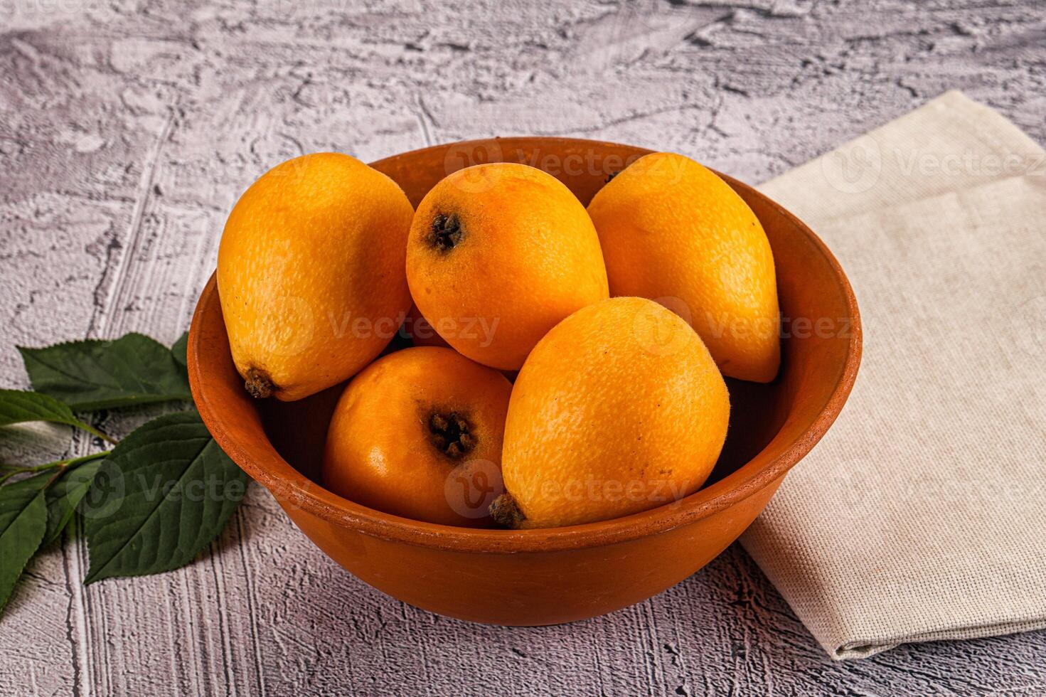 A bowl of oranges on a table photo