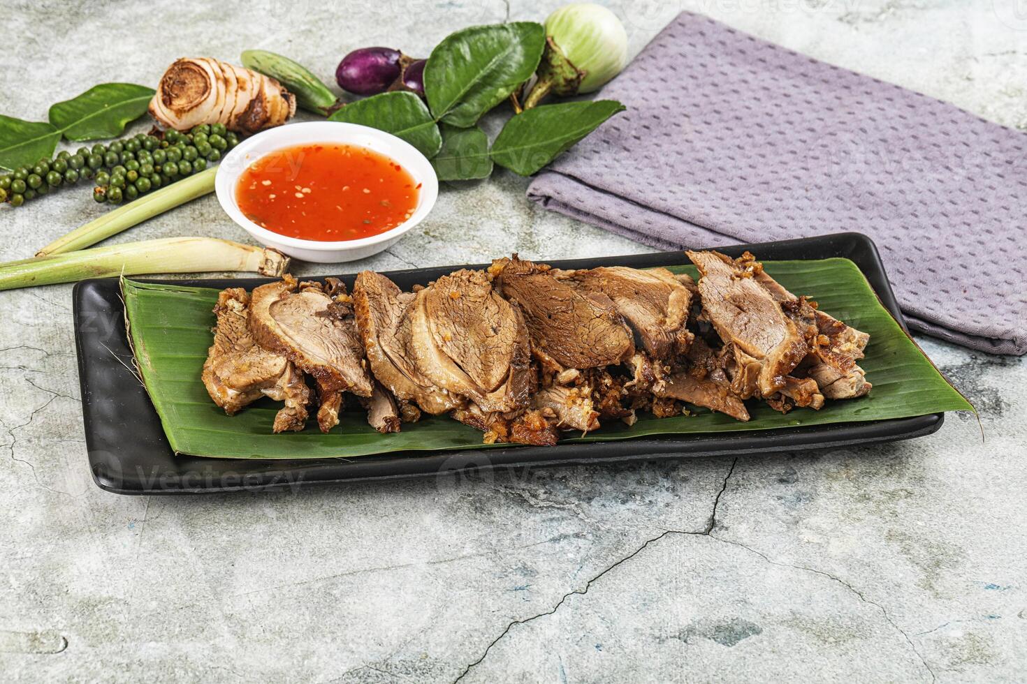 A plate with meat and vegetables on it photo