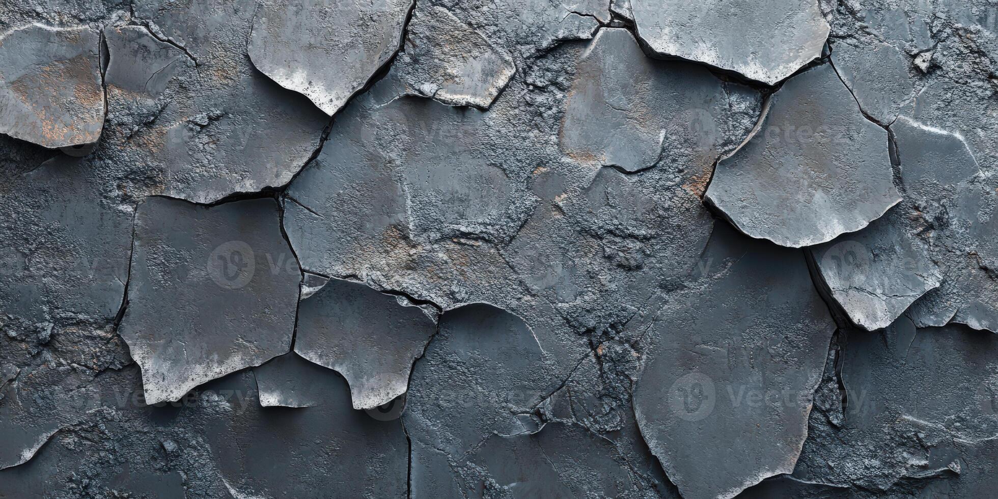 Cracked gray surface with textured pattern and layers photo