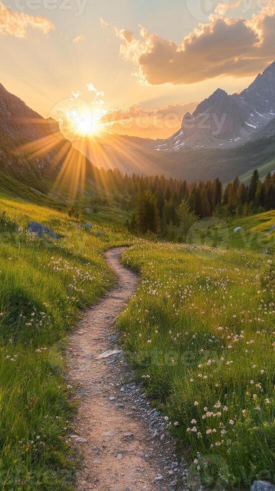 Majestic sunset over a winding path in the mountains photo