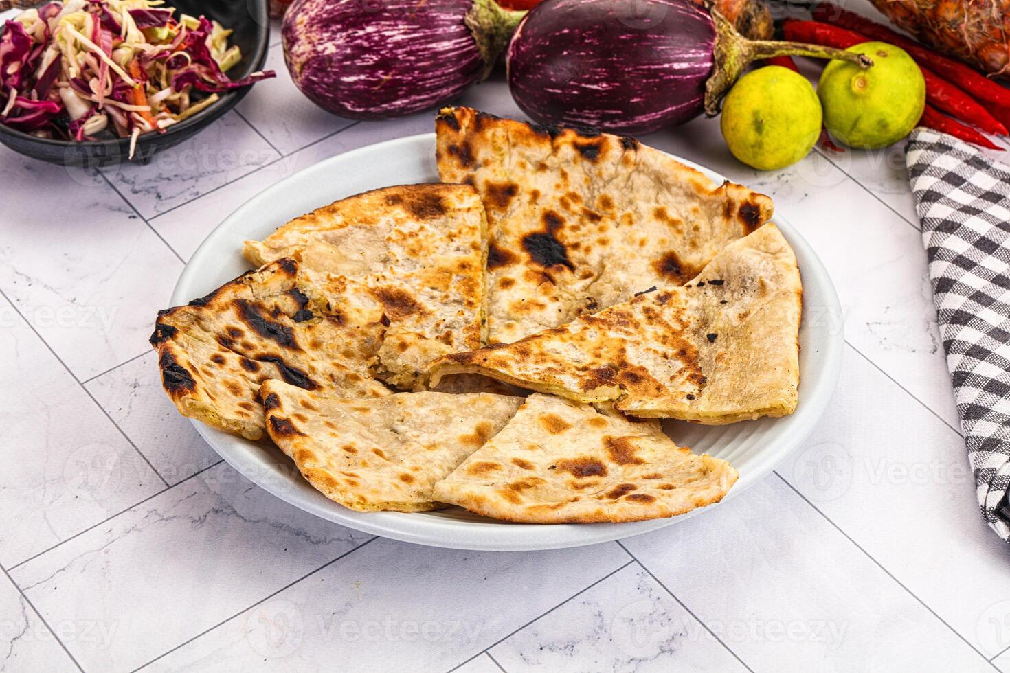 A plate of flatbreads with vegetables and other ingredients photo