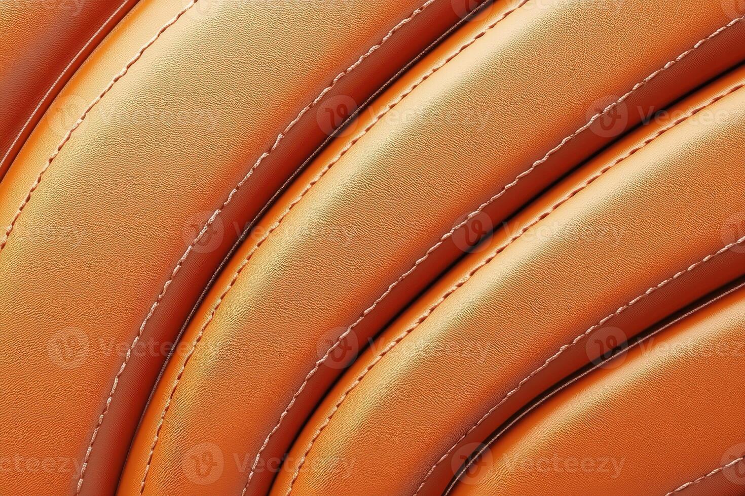 Textured orange leather pattern with curved lines and stitches photo