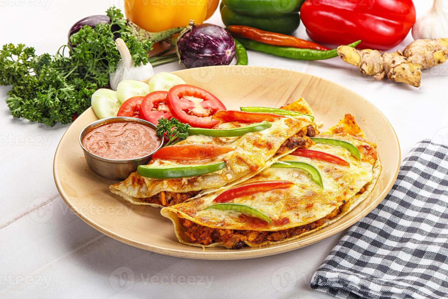 A plate of food with vegetables and dip photo