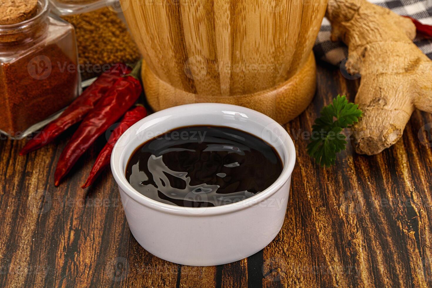 A cup of coffee and spices on a table photo
