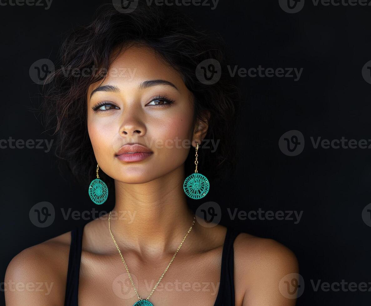 Beautiful woman posing with elegant earrings in a studio setting photo