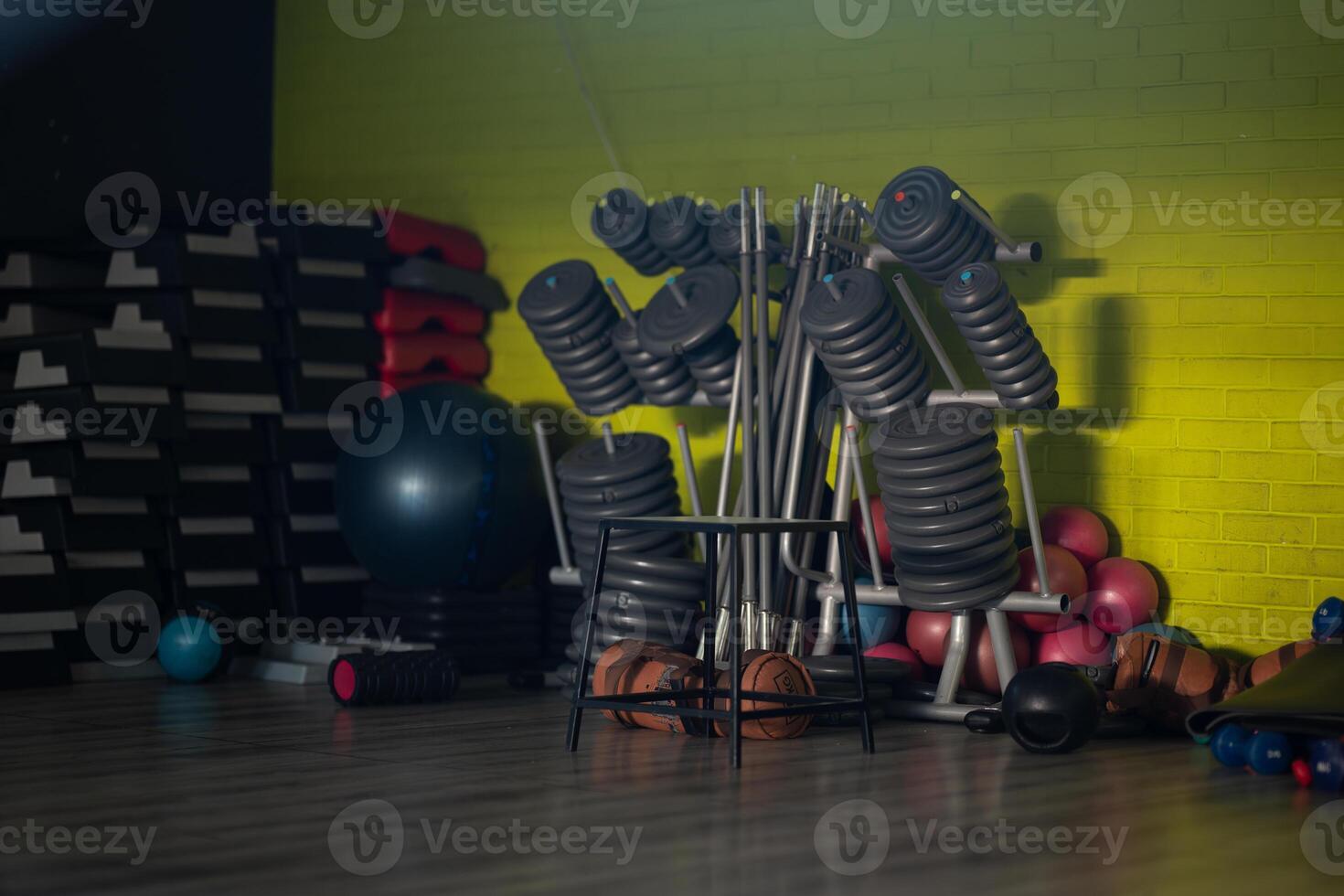 A pair of dumbbells neatly arranged in the gym, ready for a powerful workout session to build strength and endurance photo