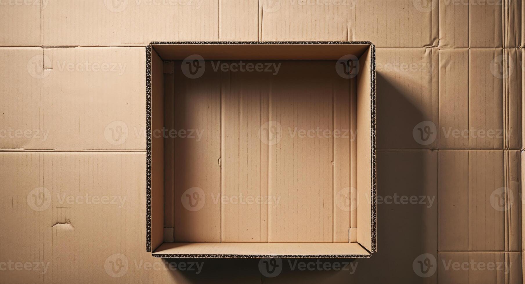 An empty cardboard box on a wall photo